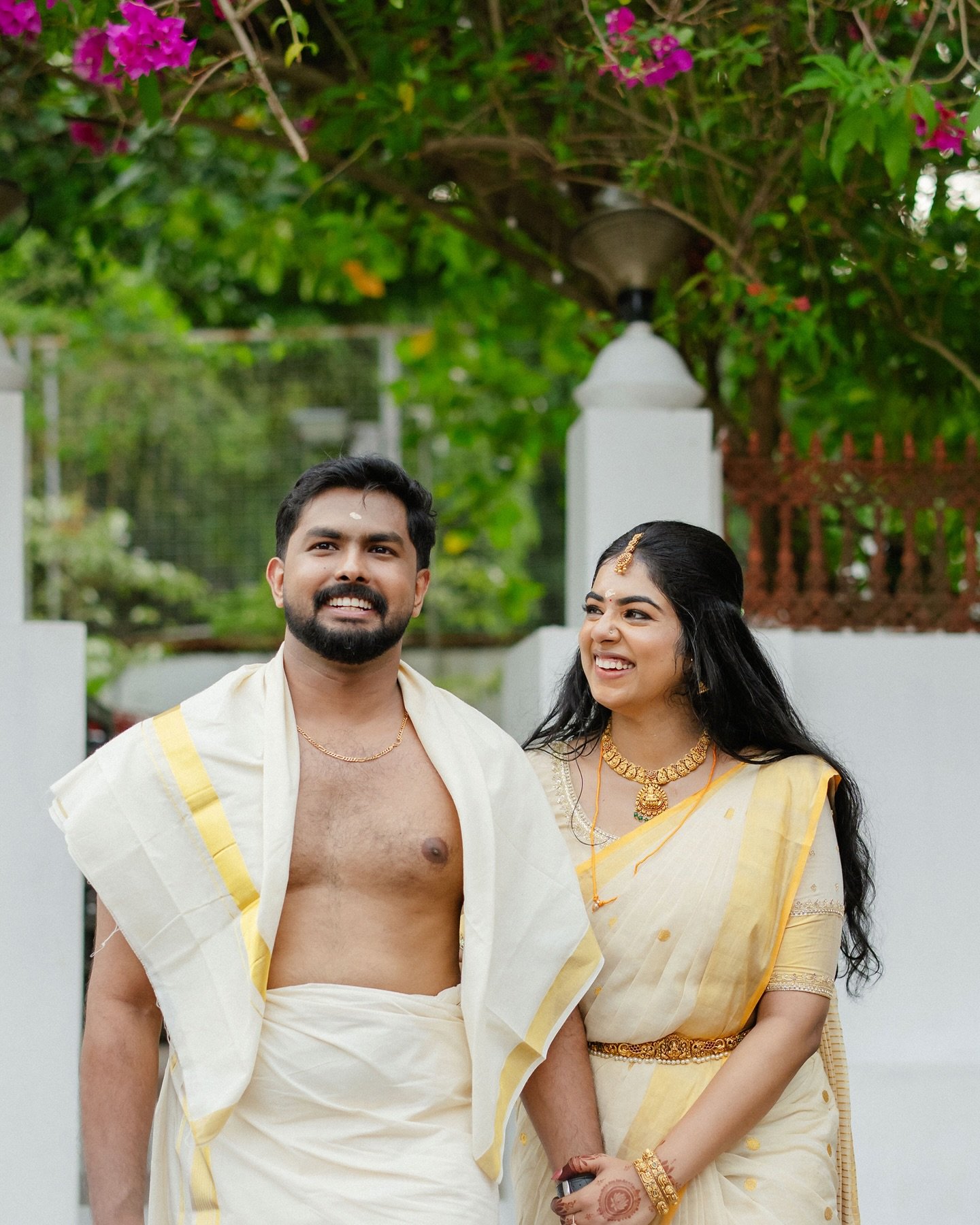 A newlywed couple embracing during traditional Kerala wedding ceremony